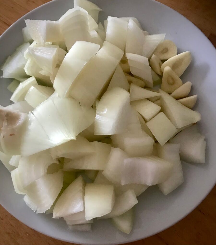 chopped onions and garlic for soup