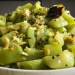 sautéed lauki with simple spices and served in a white plate