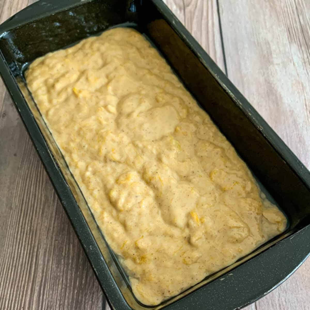 Banana and pumpkin bread batter placed on a loaf tin.