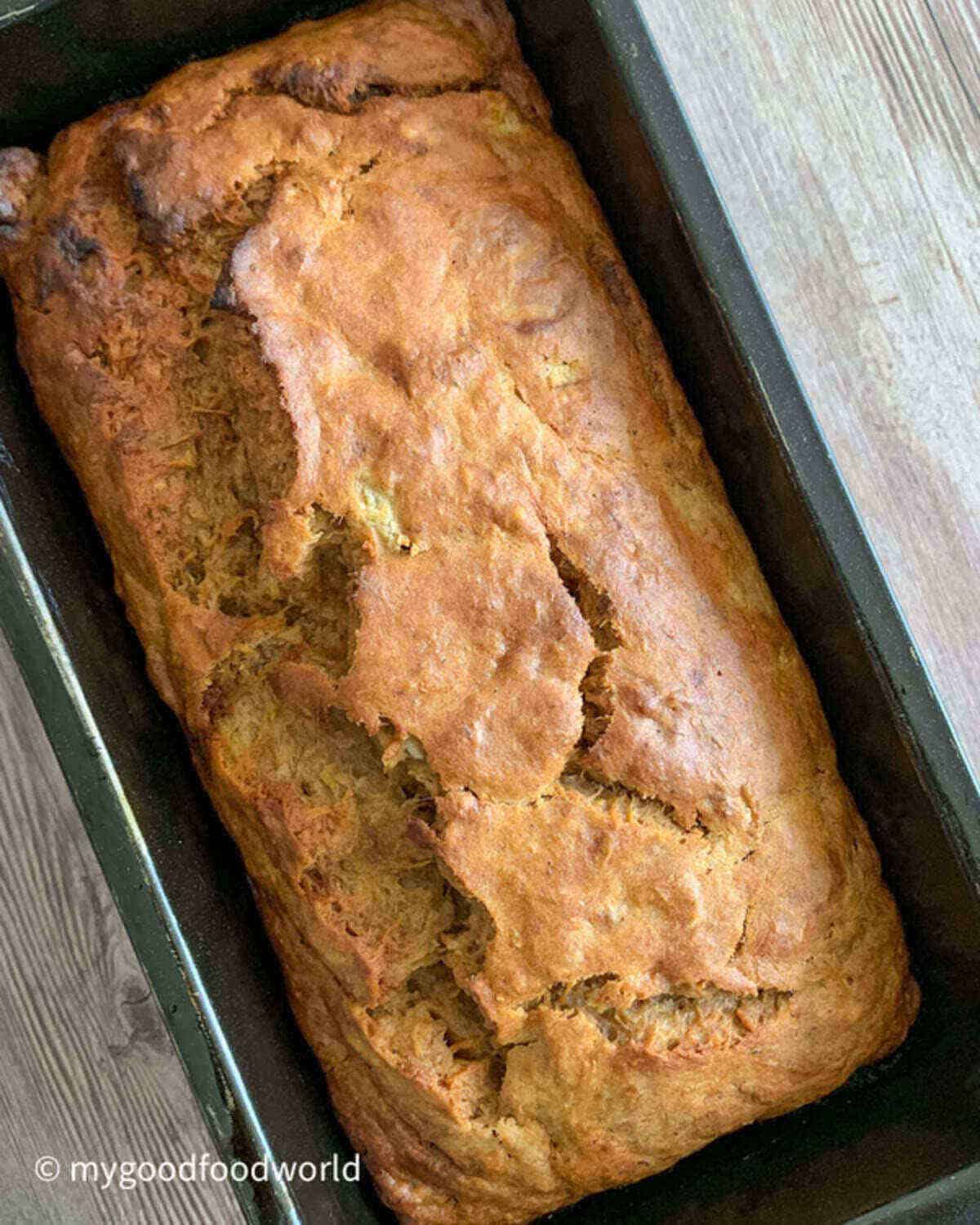 Freshly baked vegan bread with pumpkin placed on a light background.