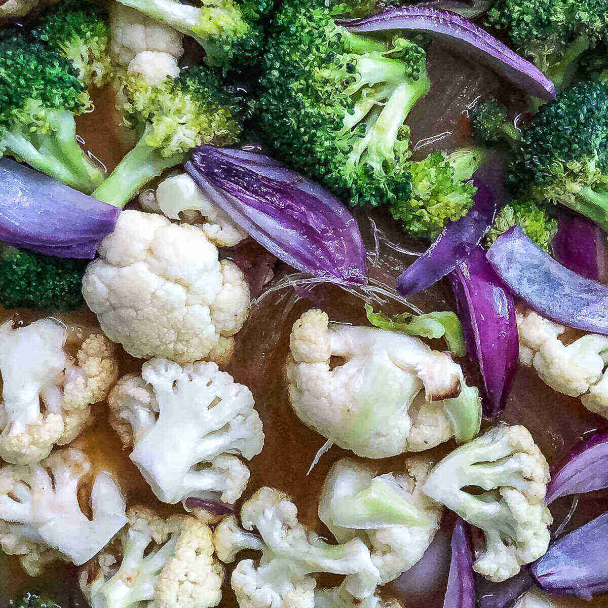 Cauliflower, and broccoli florets and onion wedges with noodles in teriyaki broth.