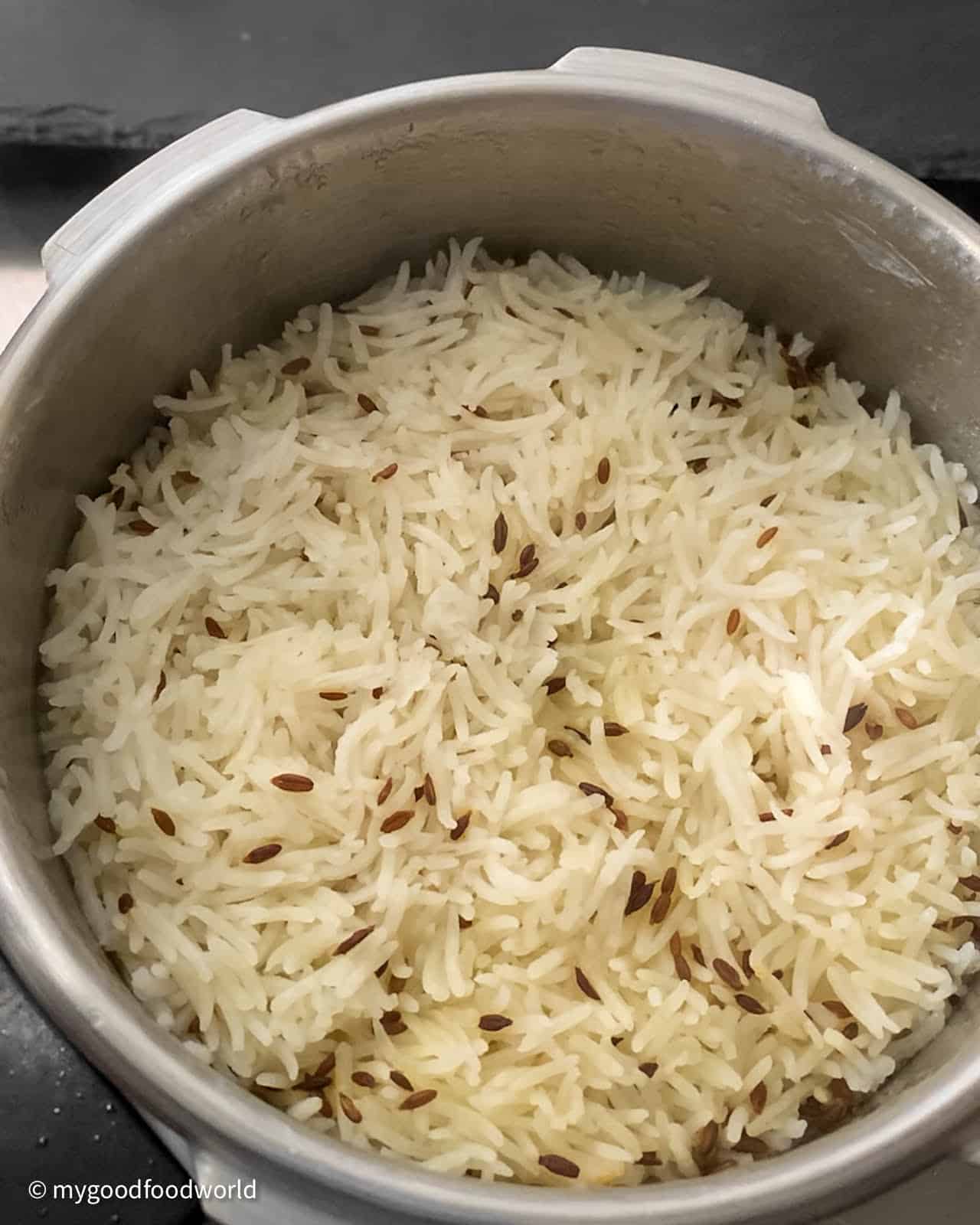 Cumin and rice that has been cooked in a pressure cooker.