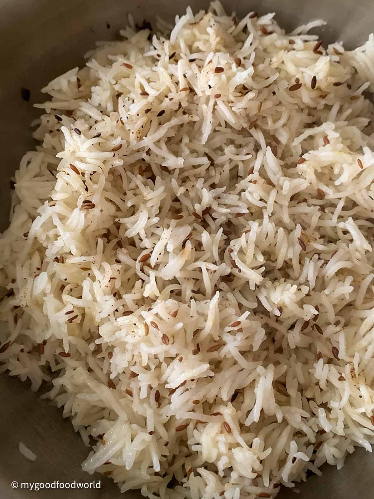 Perfectly cooked white rice with zeera that is ready to be served.