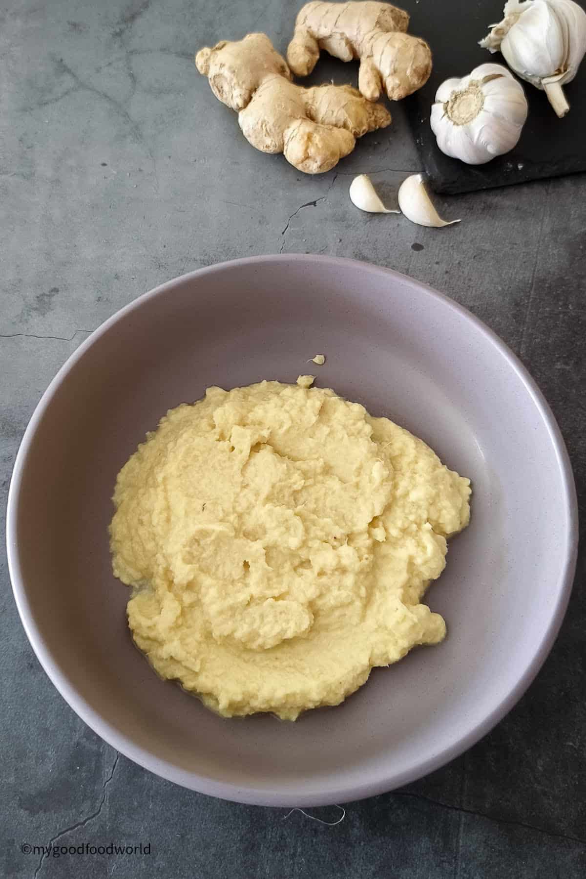 A smooth paste of ginger and garlic is placed in a bowl.