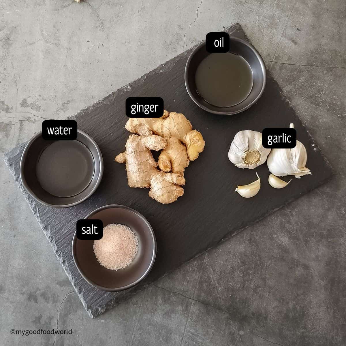 These are ingredients for making a garlic and ginger paste recipe at home.