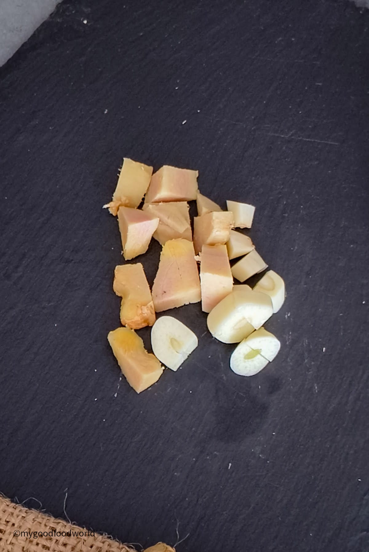 Finely chopped ginger and garlic for making paste.