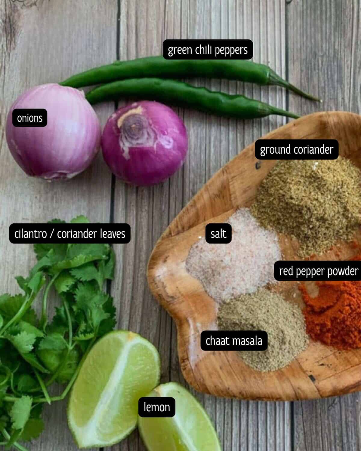 Ingredients for the Punjabi-style laccha pyaaz recipe are placed on a table.