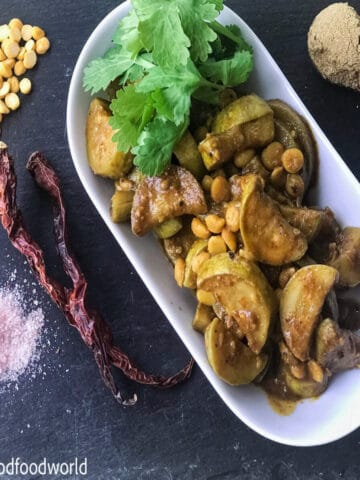 Close up photo of zucchini sabji with chana dal and simple spices.